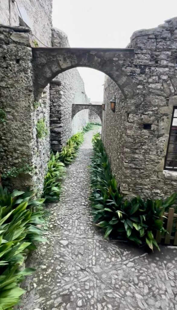 Arched cobblestone walkway in the medieval town of Erice, Sicily.