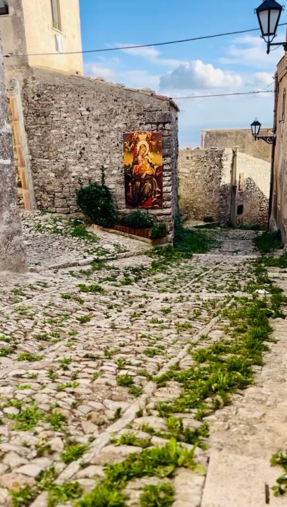 Charming cobblestone street in the medieval town of Erice, Sicily.